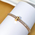 PULSEIRA DE LETRA INCRUSTADO COM ZIRCÔNIA BRILHANTE BANHADA EM OURO 18K