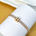 PULSEIRA DE LETRA INCRUSTADO COM ZIRCÔNIA BRILHANTE BANHADA EM OURO 18K