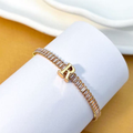 PULSEIRA DE LETRA INCRUSTADO COM ZIRCÔNIA BRILHANTE BANHADA EM OURO 18K