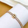 PULSEIRA DE LETRA INCRUSTADO COM ZIRCÔNIA BRILHANTE BANHADA EM OURO 18K